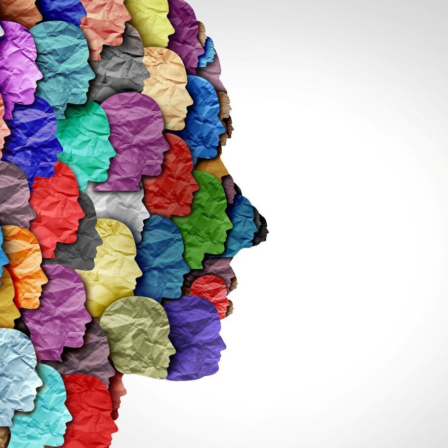 A paper face composed of many miniature coloured paper faces